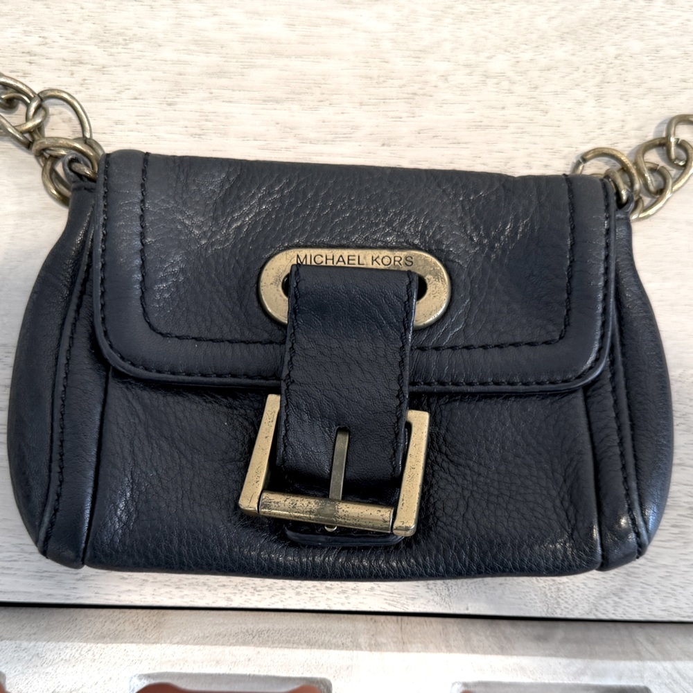 Vintage Michael Kors black leather crossbody with brass details.